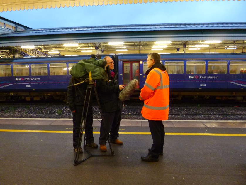 Standing Still. Exeter St Davids, BBC Film crew interview First Great Westerb representative, 24 December, 2012.