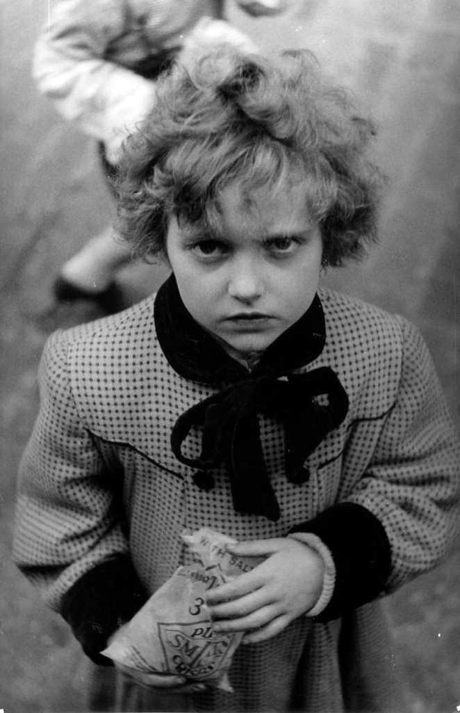 "East End Beauty", Hans whatsit title. Christopher comments "Well she isn't my sister so I don't know who she is. However, I do remember those Smiths Crisps bags."